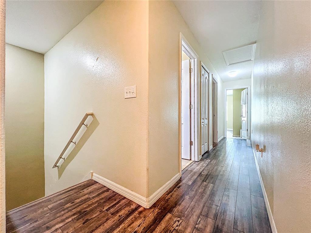 9873 Trumpet Vine Loop Trinity, FL 34655 - Photo 25 of 40 a view of a hallway with wooden floor
