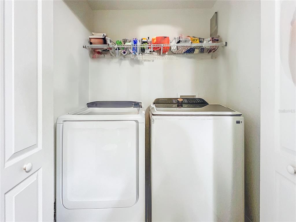 9873 Trumpet Vine Loop Trinity, FL 34655 - Photo 28 of 40 a utility room with dryer and washer