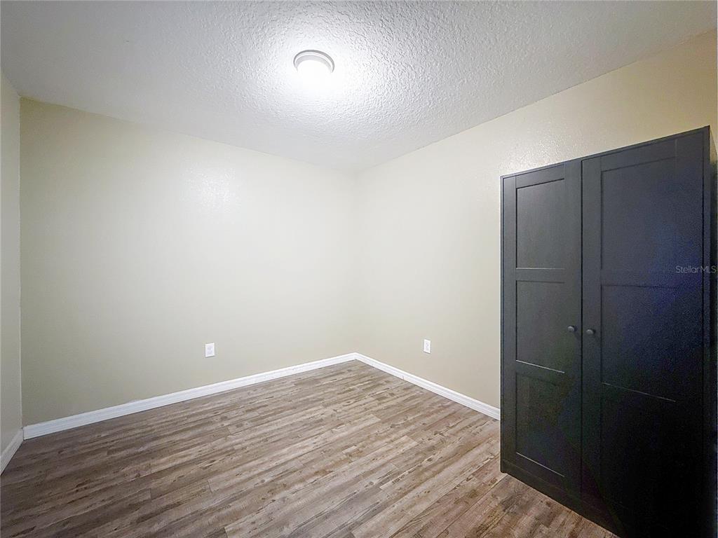 9873 Trumpet Vine Loop Trinity, FL 34655 - Photo 30 of 40 wooden floor in an empty room
