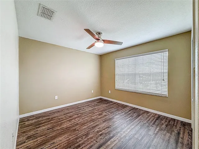 an aerial view of a house and a yard