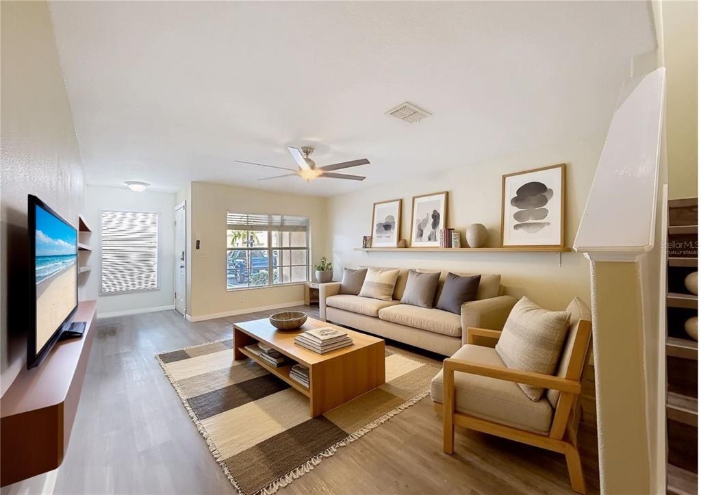 9873 Trumpet Vine Loop Trinity, FL 34655 - Photo 5 of 40 a living room with furniture flat screen tv and window