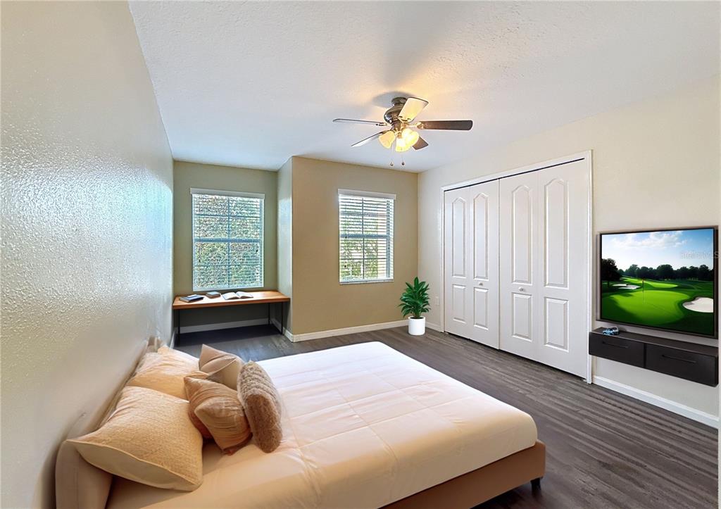 9873 Trumpet Vine Loop Trinity, FL 34655 - Photo 6 of 40 a bedroom with a bed and a window