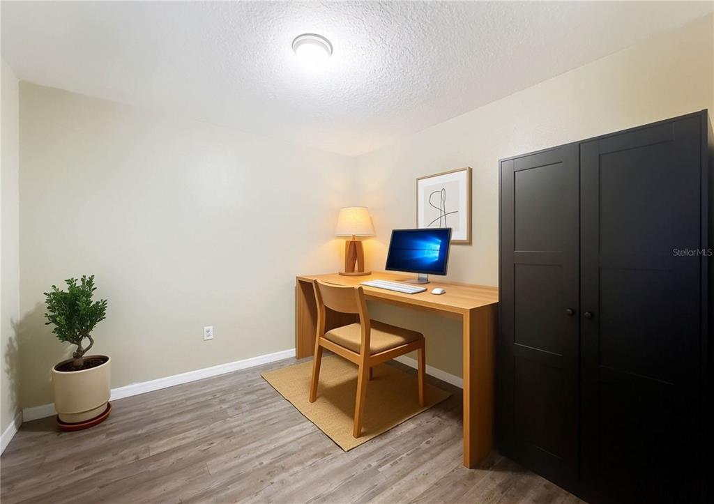 9873 Trumpet Vine Loop Trinity, FL 34655 - Photo 7 of 40 a workspace with furniture and wooden floor