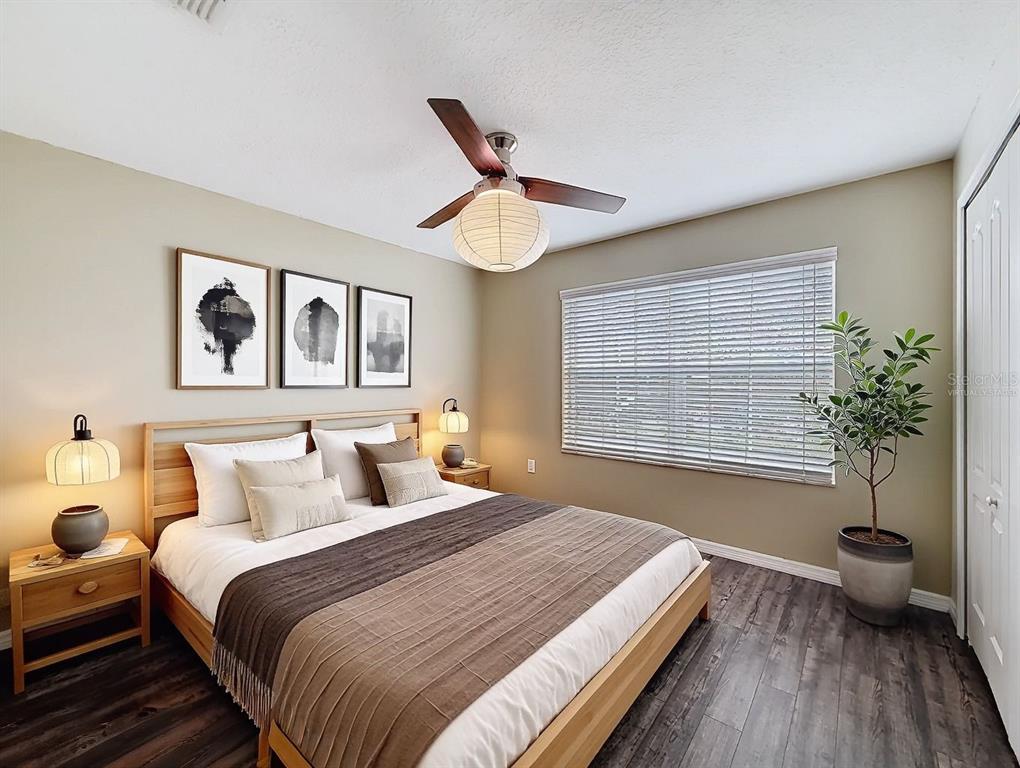 9873 Trumpet Vine Loop Trinity, FL 34655 - Photo 8 of 40 a bedroom with a bed and a window