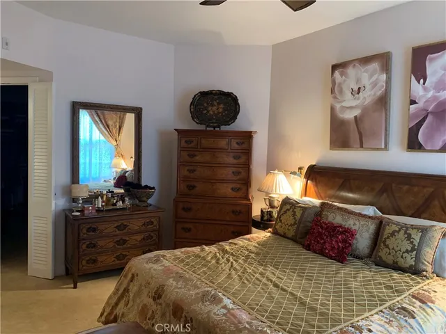 a bedroom with a bed and furniture