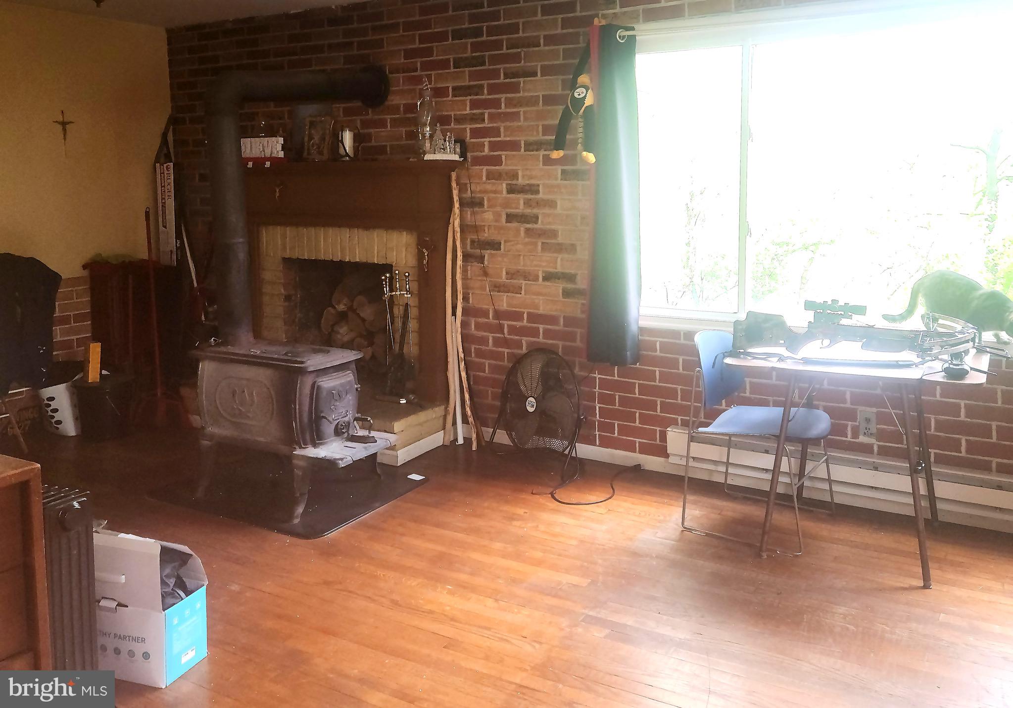 5703 Tobery Road Frederick, MD 21704 - Photo 21 of 36 Hardwood floors & wood-burning FP.