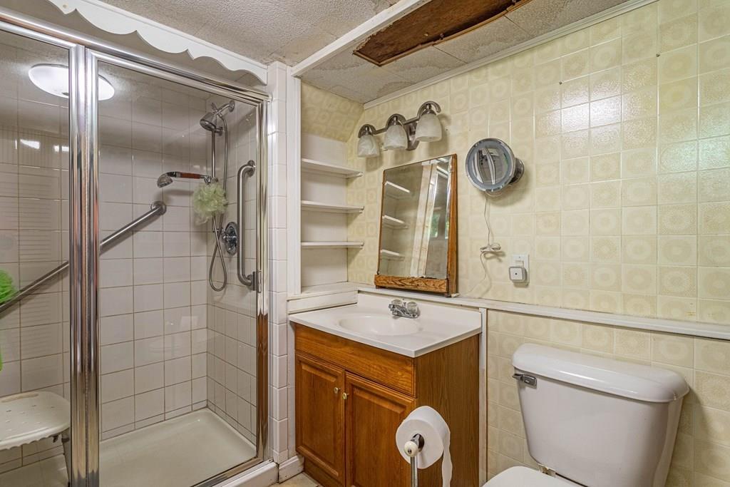 9 Foster Road Milford, NH 03055 - Photo 30 of 31 a bathroom with a shower and mirror