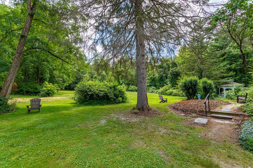 9 Foster Road Milford, NH 03055 - Photo 6 of 31 a view of a backyard with green space