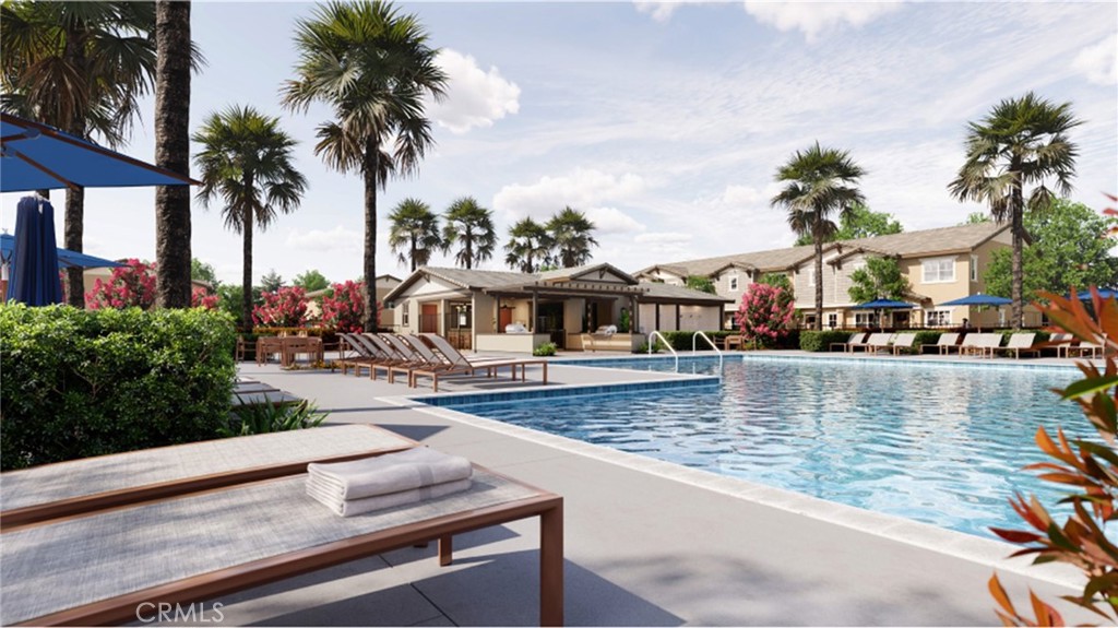 19128 Chestnut Grv Court Riverside, CA 92507 - Photo 14 of 20 a view of a swimming pool with a table and chairs