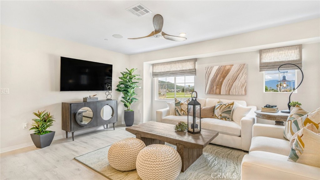 19128 Chestnut Grv Court Riverside, CA 92507 - Photo 6 of 20 a living room with furniture and a flat screen tv