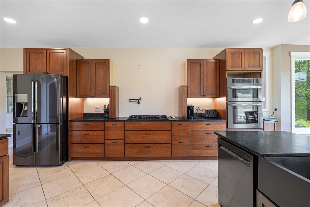 19 Hardscrabble Road Sterling, MA 01564 - Photo 15 of 42 a kitchen with granite countertop stainless steel appliances and counter space
