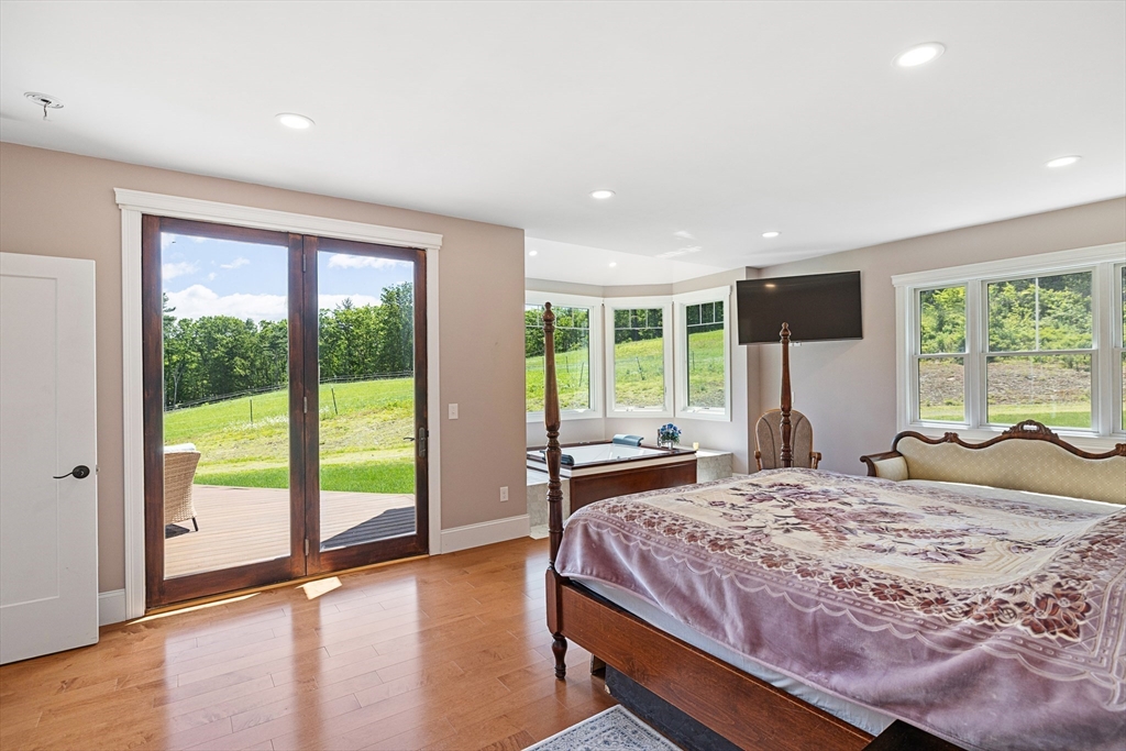 19 Hardscrabble Road Sterling, MA 01564 - Photo 18 of 42 a bedroom with a large bed and a large window