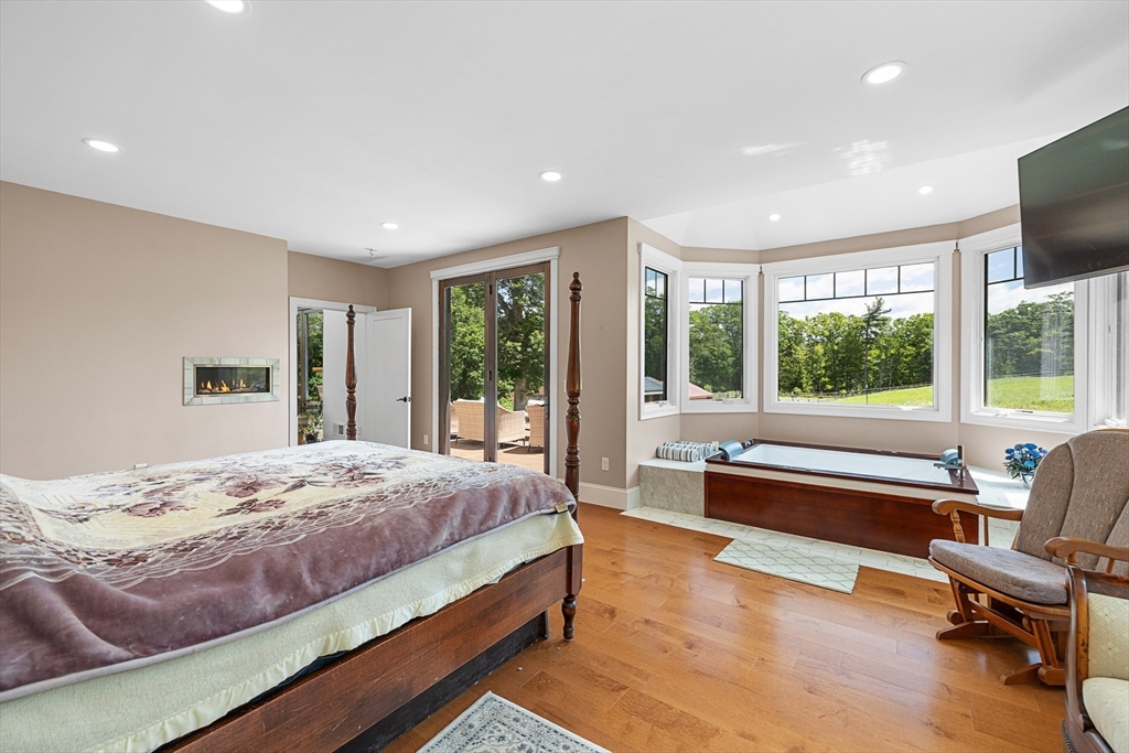 19 Hardscrabble Road Sterling, MA 01564 - Photo 19 of 42 a bedroom with a large bed and a large window