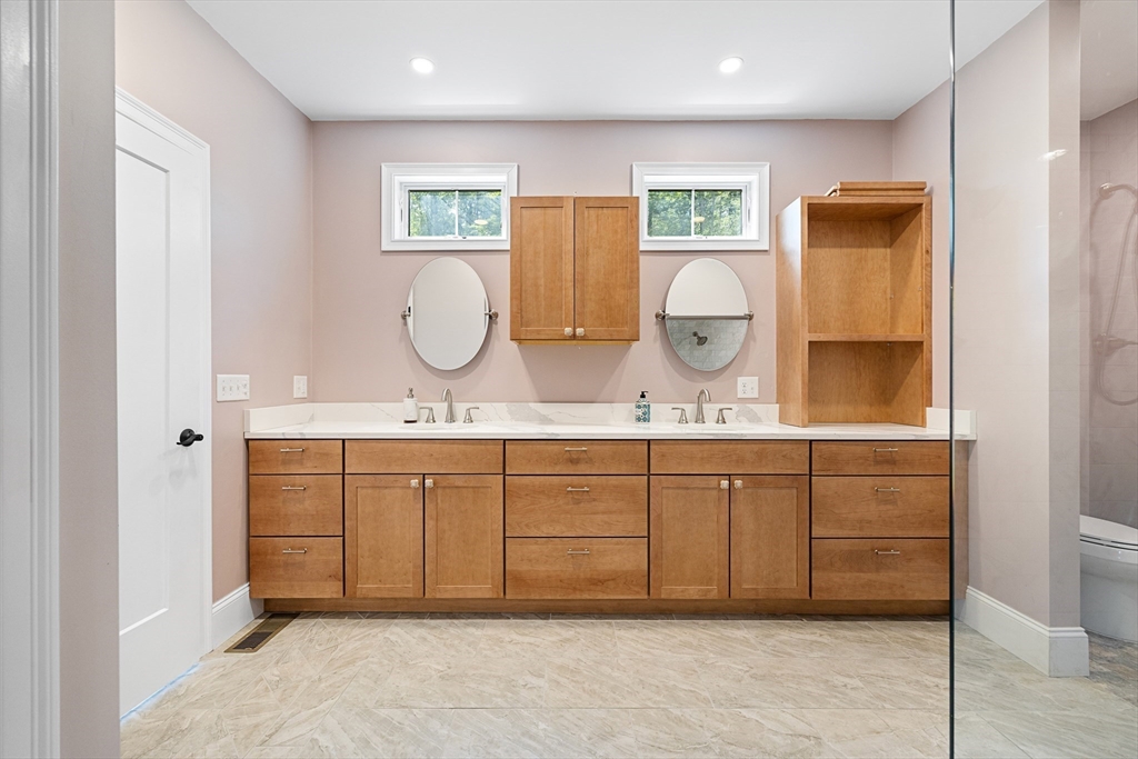 19 Hardscrabble Road Sterling, MA 01564 - Photo 23 of 42 a spacious bathroom with a granite countertop sink mirror and vanity