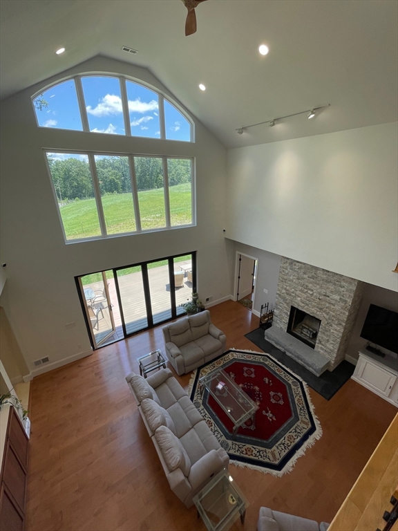 19 Hardscrabble Road Sterling, MA 01564 - Photo 28 of 42 a living room with furniture and a floor to ceiling window