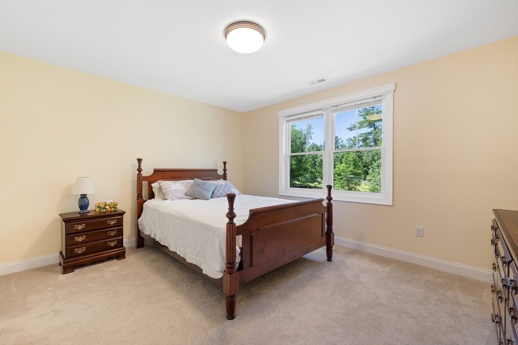 19 Hardscrabble Road Sterling, MA 01564 - Photo 31 of 42 a bed sitting in a bedroom next to a window