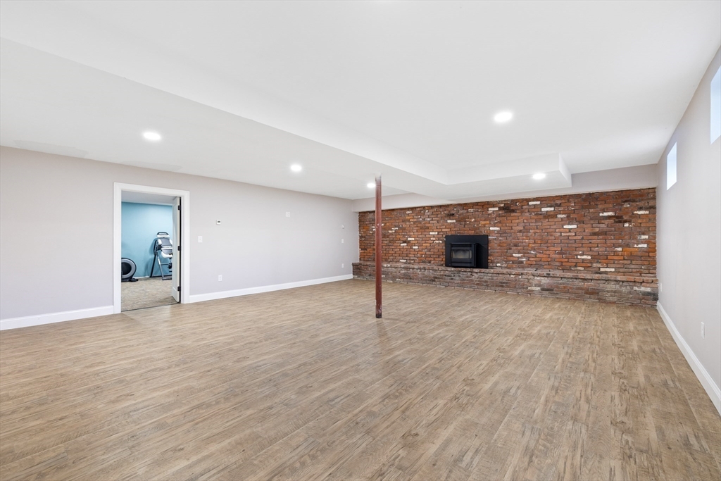 19 Hardscrabble Road Sterling, MA 01564 - Photo 34 of 42 a view of an empty room with wooden floor and a window