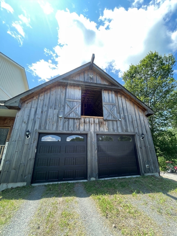 19 Hardscrabble Road Sterling, MA 01564 - Photo 37 of 42 a front view of a house with a yard