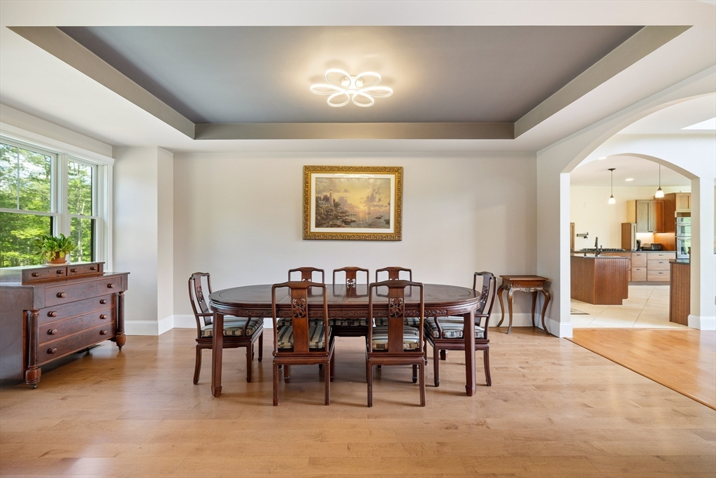 19 Hardscrabble Road Sterling, MA 01564 - Photo 7 of 42 a view of a dining room with furniture and chandelier
