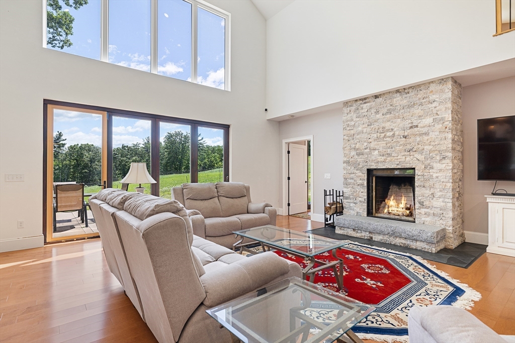 19 Hardscrabble Road Sterling, MA 01564 - Photo 8 of 42 a living room with furniture and a fireplace
