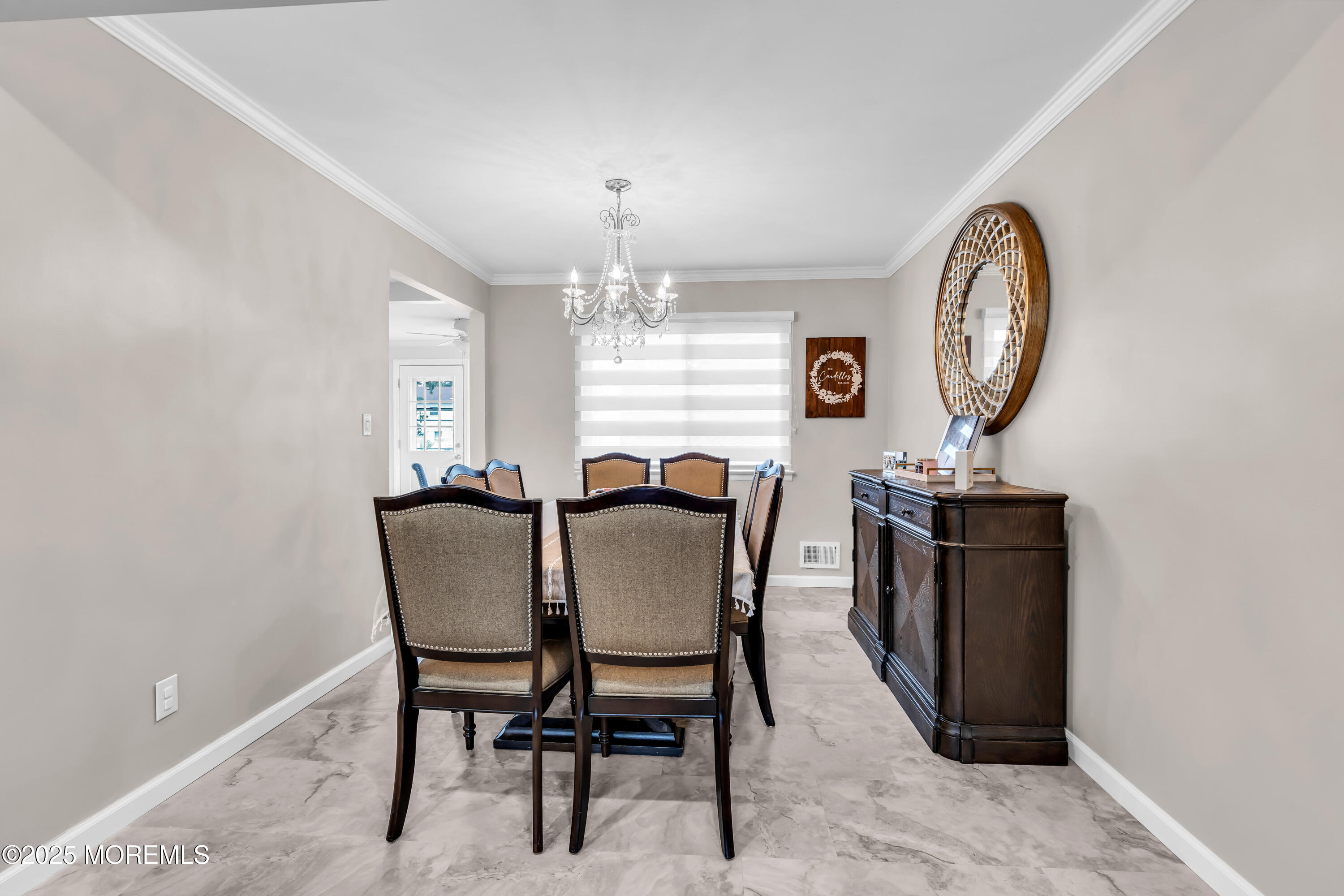 15 Windsor Road Howell, NJ 07731 - Photo 9 of 46 a view of a dining room with furniture and a chandelier