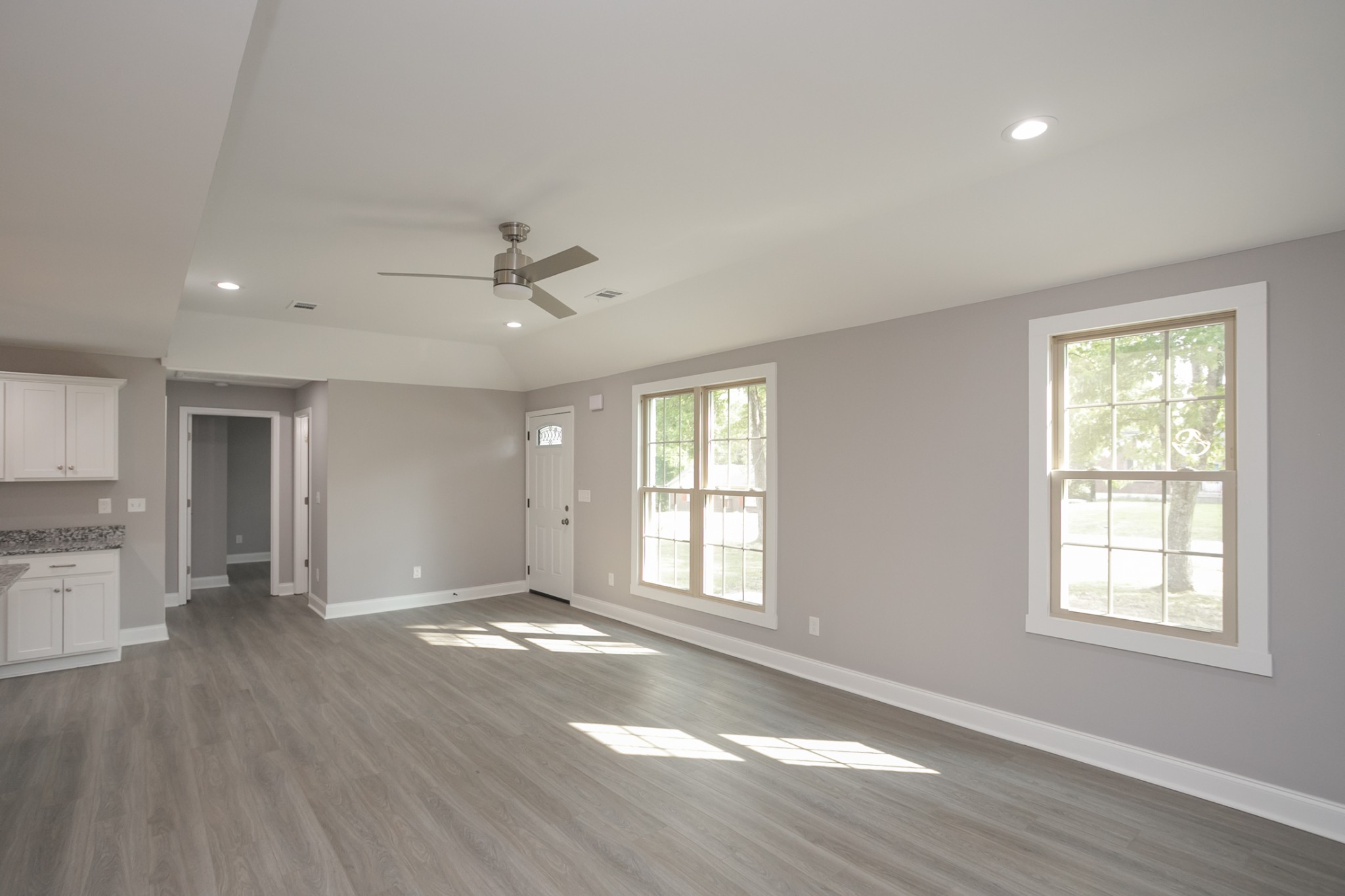 1229 Berwick Trail Madison, TN 37115 - Photo 11 of 47 a view of an empty room with a window and wooden floor