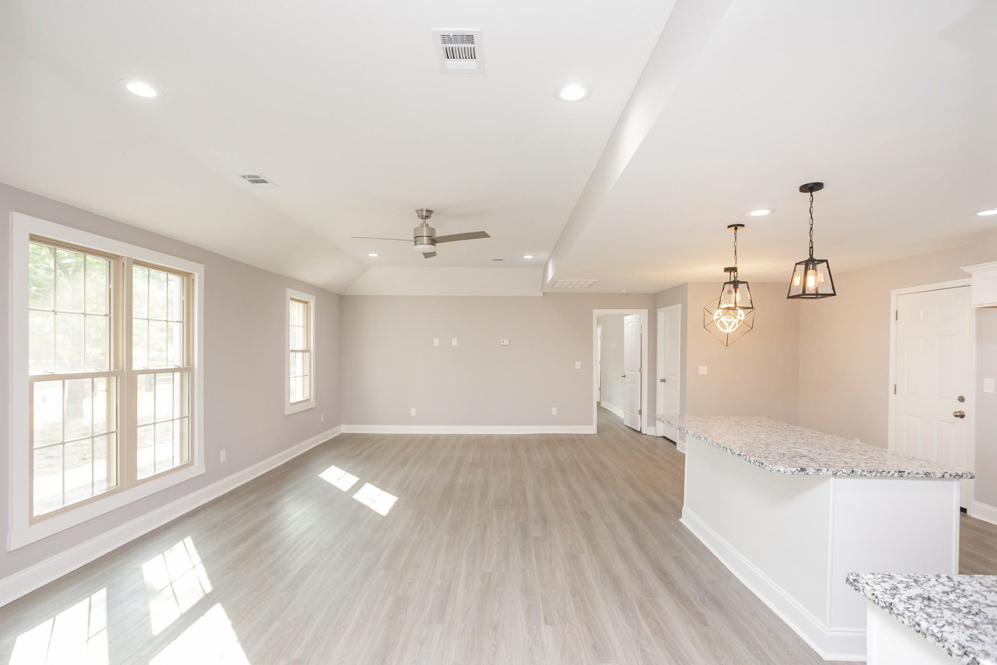 1229 Berwick Trail Madison, TN 37115 - Photo 12 of 47 a view of an empty room with wooden floor and a window