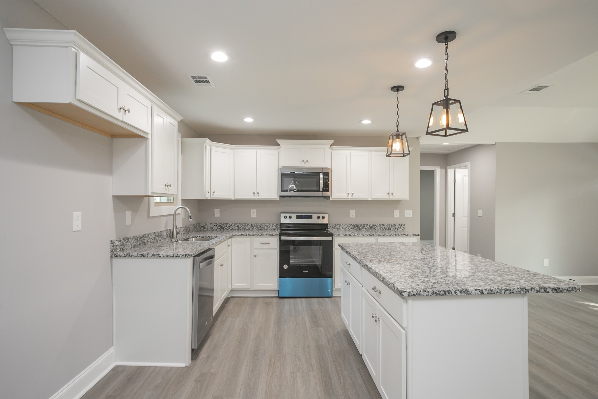 1229 Berwick Trail Madison, TN 37115 - Photo 23 of 47 a kitchen with stainless steel appliances granite countertop a sink stove and refrigerator