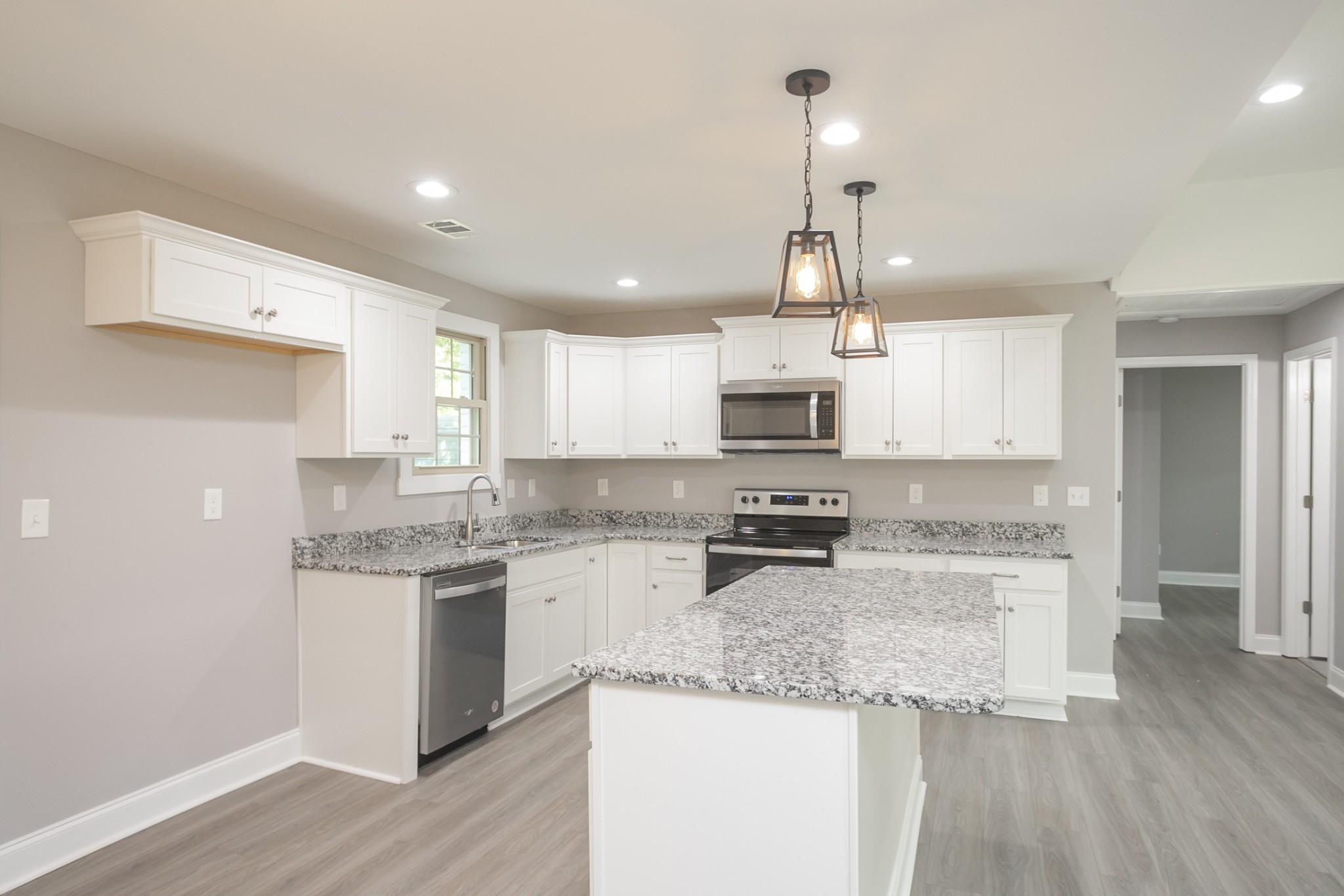 1229 Berwick Trail Madison, TN 37115 - Photo 24 of 47 a kitchen with stainless steel appliances granite countertop a sink stove and refrigerator