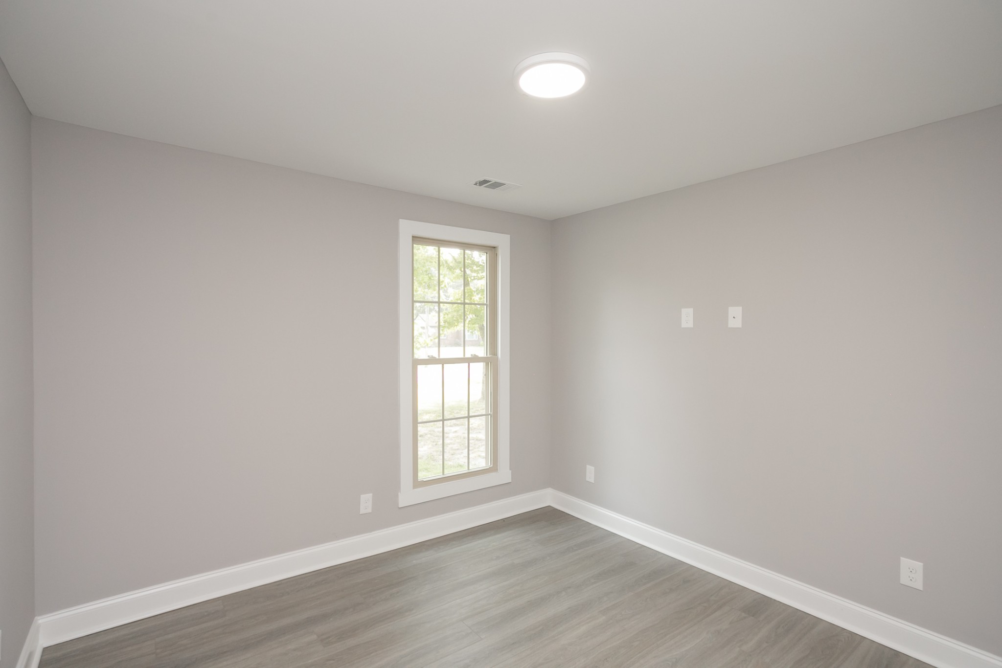 1229 Berwick Trail Madison, TN 37115 - Photo 33 of 47 an empty room with wooden floor and windows