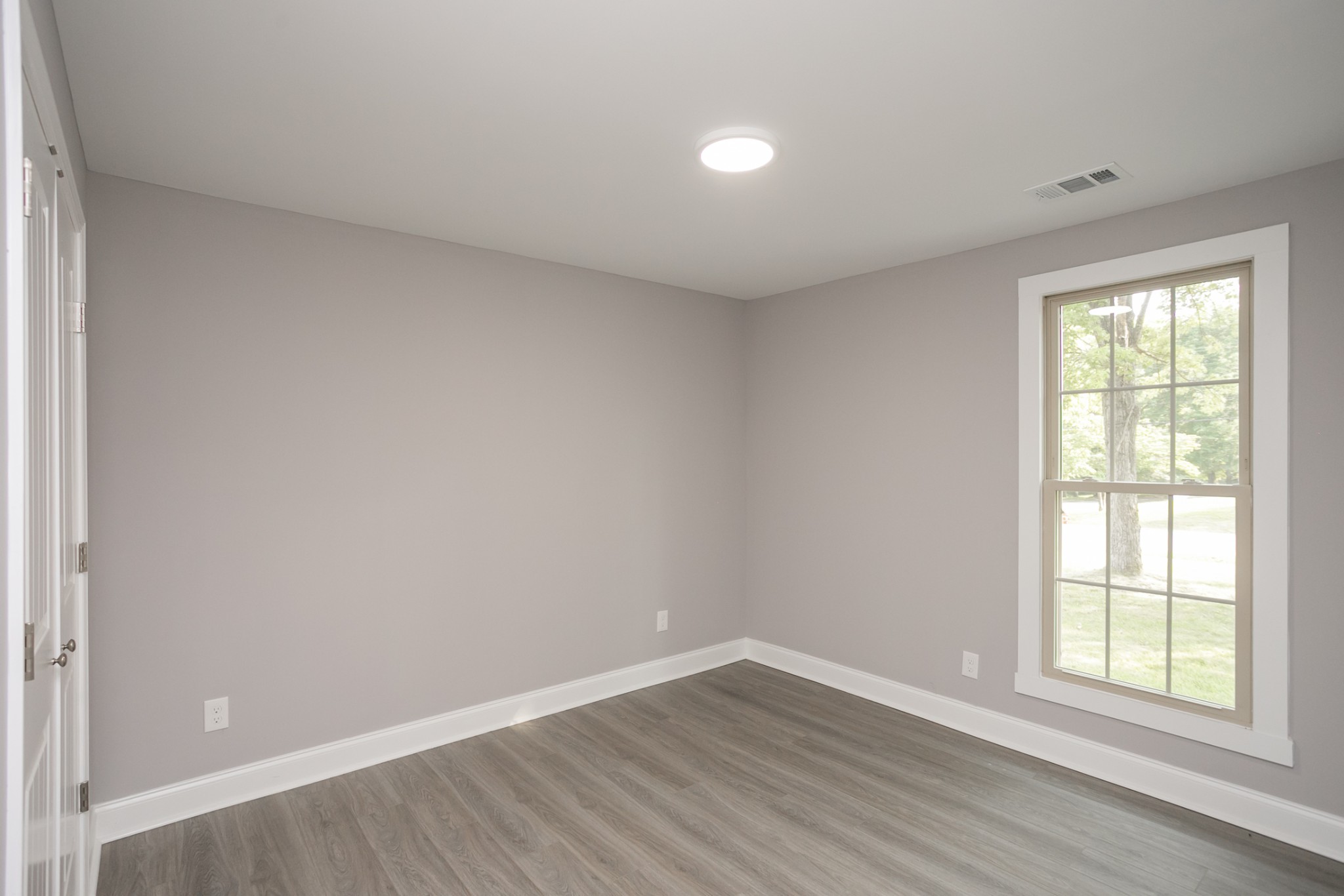 1229 Berwick Trail Madison, TN 37115 - Photo 39 of 47 an empty room with wooden floor and windows