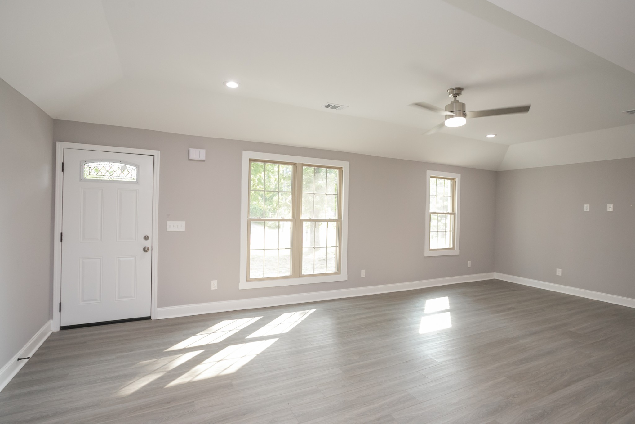 1229 Berwick Trail Madison, TN 37115 - Photo 10 of 47 a view of an empty room with a window and wooden floor