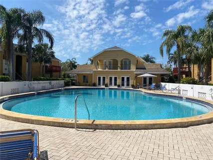 a front view of a house with swimming pool