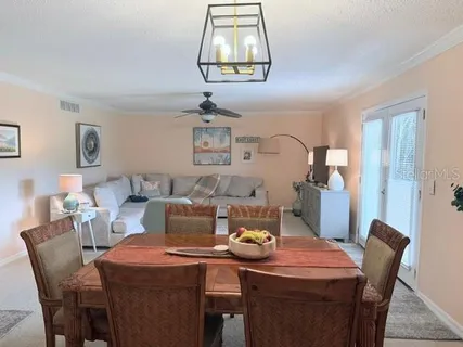 a dining room with furniture and window