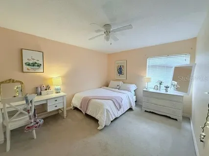 a bed room with a bed and a window