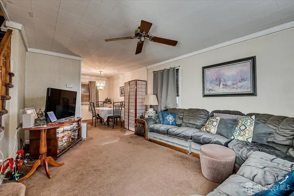 a view of a livingroom with furniture and toys