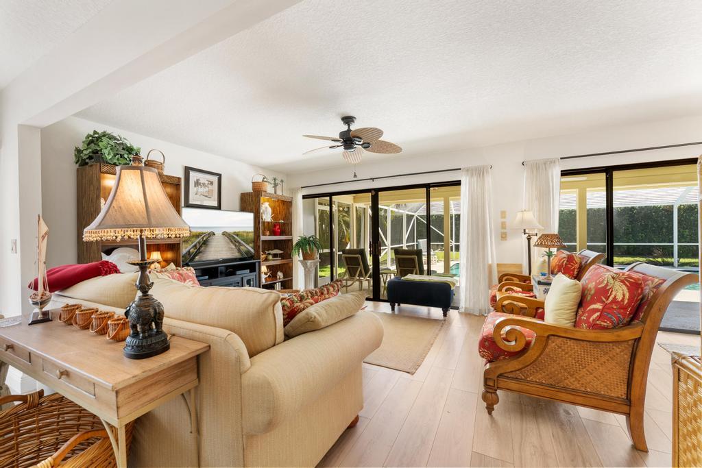 108 Pegasus Drive Jupiter, FL 33477 - Photo 11 of 74 a living room with furniture and a large window