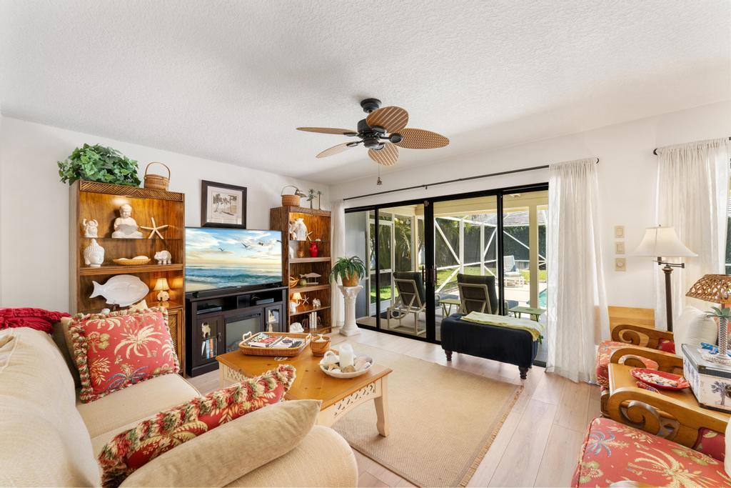 108 Pegasus Drive Jupiter, FL 33477 - Photo 13 of 74 a living room with furniture and a fireplace