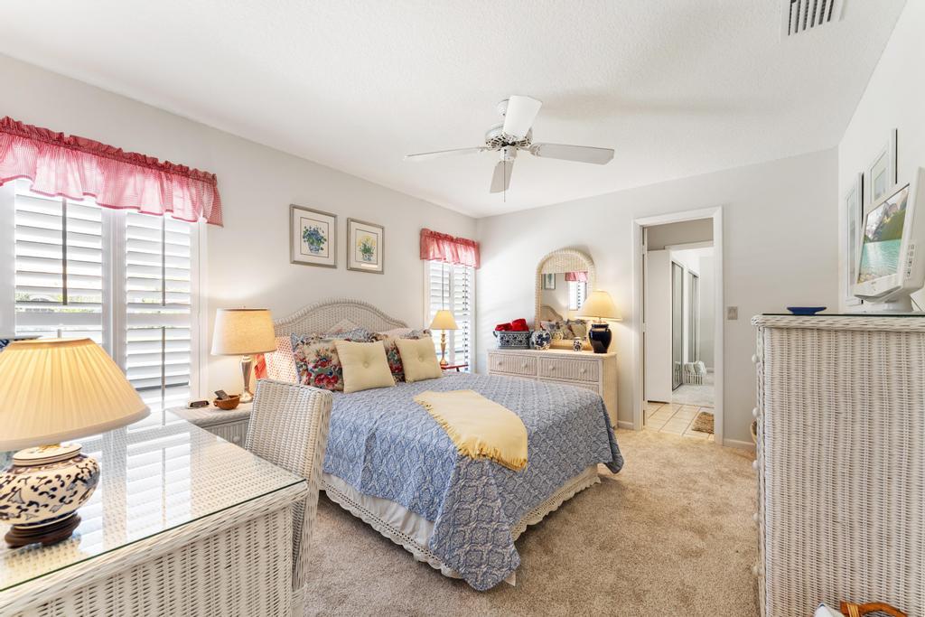108 Pegasus Drive Jupiter, FL 33477 - Photo 31 of 74 a spacious bedroom with a bed and window