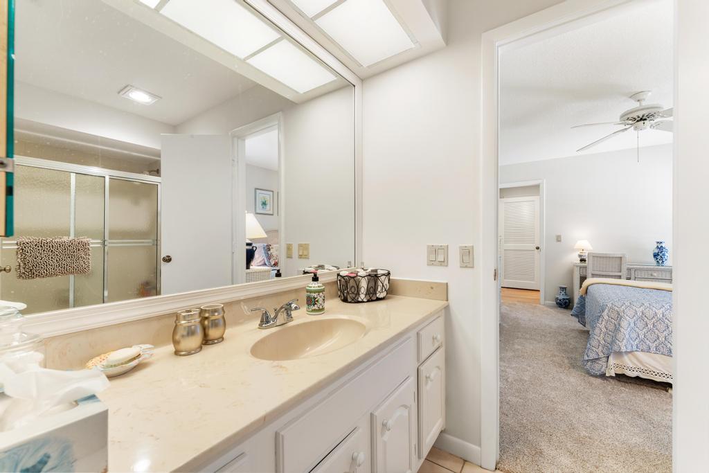 108 Pegasus Drive Jupiter, FL 33477 - Photo 34 of 74 a en suite bathroom with double vanity sinks and a mirror