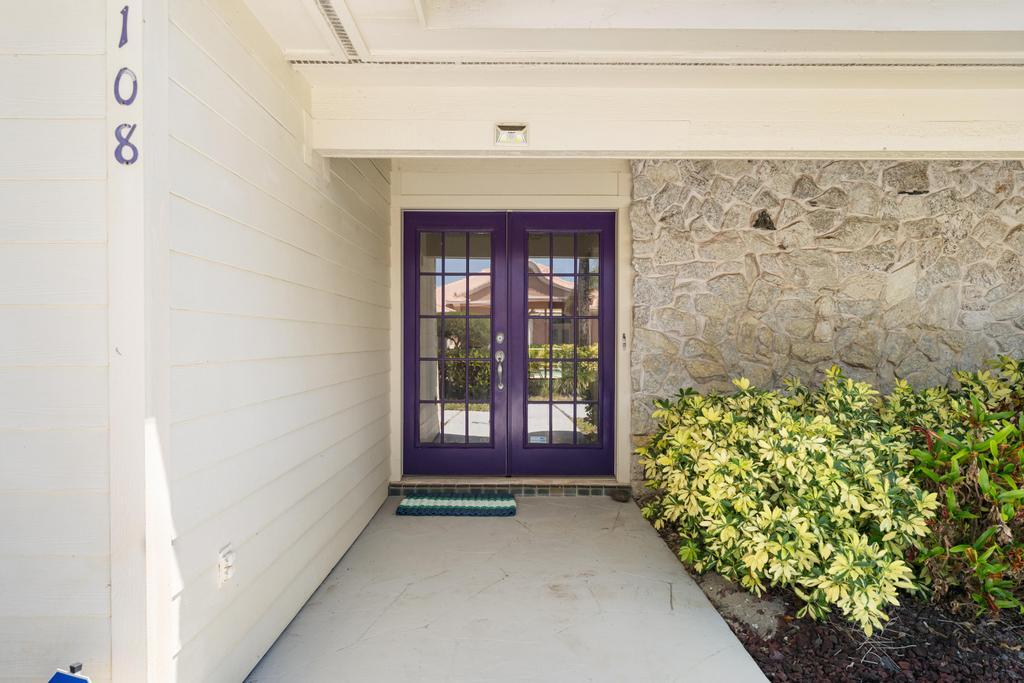 108 Pegasus Drive Jupiter, FL 33477 - Photo 4 of 74 a view of a entryway door of the house
