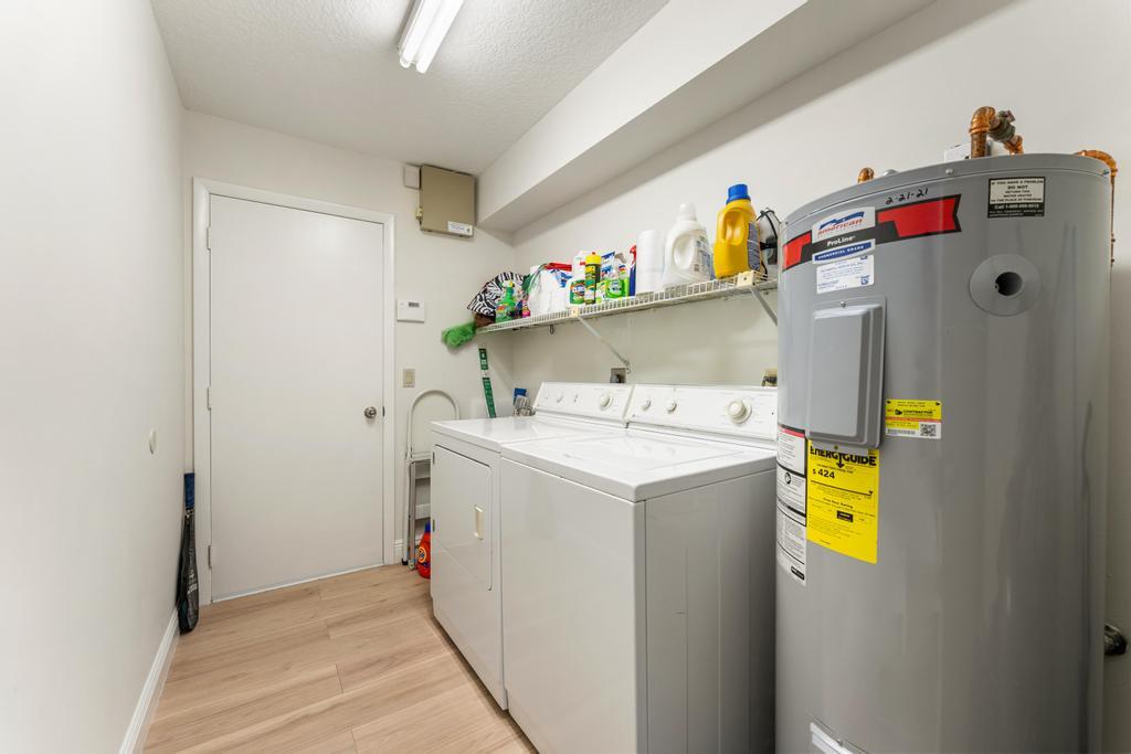 108 Pegasus Drive Jupiter, FL 33477 - Photo 41 of 74 a utility room with dryer and washer