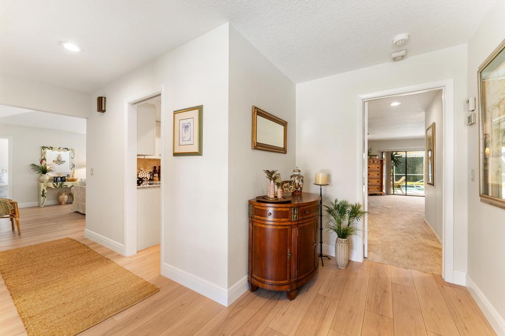 108 Pegasus Drive Jupiter, FL 33477 - Photo 5 of 74 a living room with furniture and a wooden floor