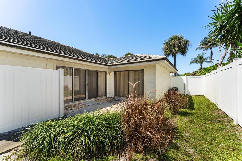 108 Pegasus Drive Jupiter, FL 33477 - Photo 55 of 74 front view of a house with a yard