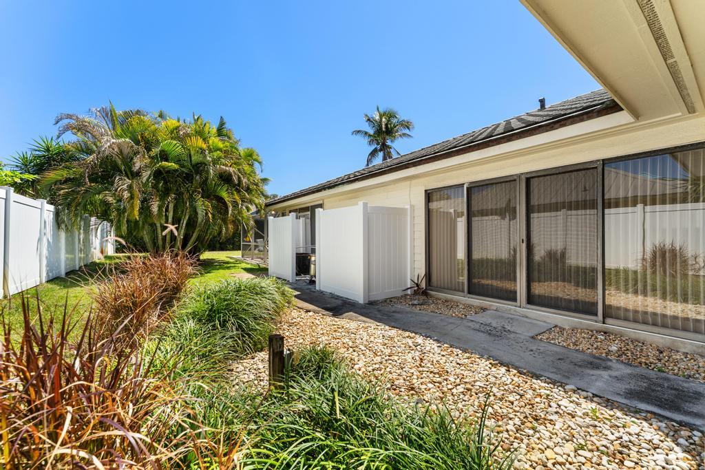 108 Pegasus Drive Jupiter, FL 33477 - Photo 56 of 74 a view of a house with a yard