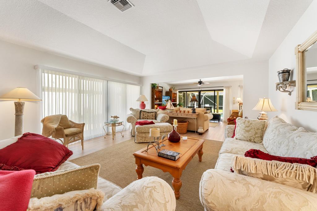 108 Pegasus Drive Jupiter, FL 33477 - Photo 7 of 74 a living room with furniture and a window