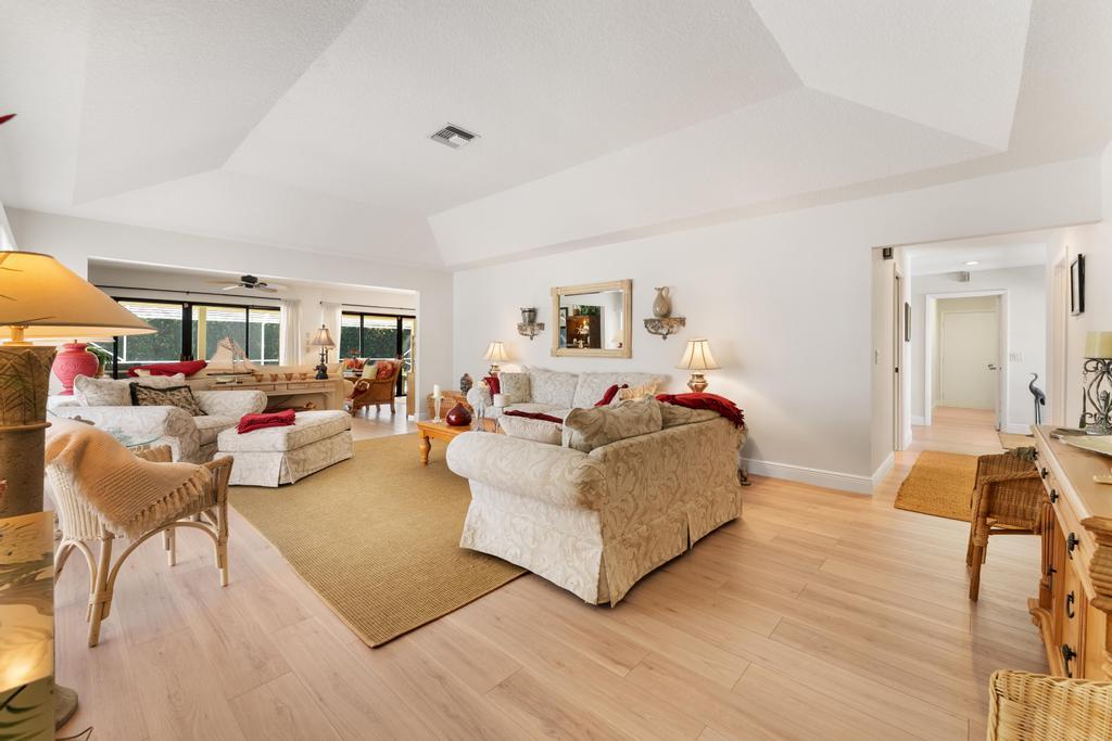 108 Pegasus Drive Jupiter, FL 33477 - Photo 9 of 74 a living room with furniture and a wooden floor
