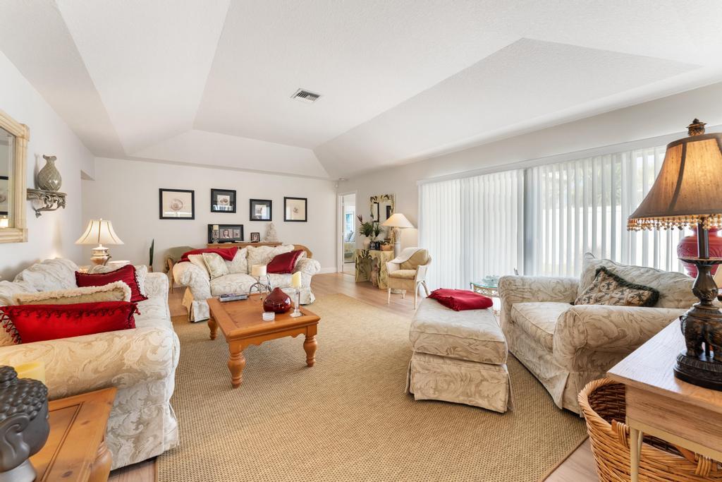 108 Pegasus Drive Jupiter, FL 33477 - Photo 10 of 74 a bedroom with furniture and a couch