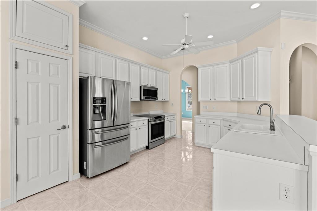 196 Lakeridge Drive Temple, GA 30179 - Photo 14 of 62 a kitchen with refrigerator a sink and cabinets