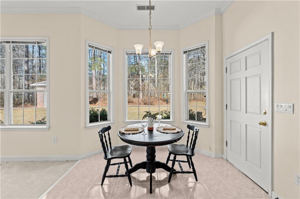 196 Lakeridge Drive Temple, GA 30179 - Photo 16 of 62 a view of a dining room with furniture window and outside view